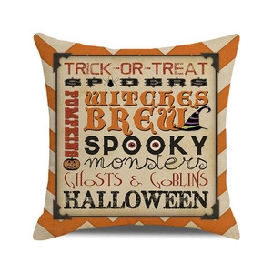 Detail of Halloween pillow cover showing orange chevron pattern and vintage spooky print