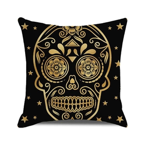 Close-up of Halloween sugar skull pillowcase with shiny gold foil stars on black fabric