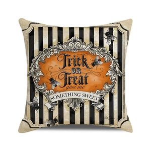 Detail of square Halloween cushion cover with Trick or Treat slogan and striped pattern