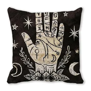 Coussin décoratif carré noir avec motifs de chiromancie et symboles astrologiques