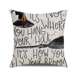 Macro detail of the woven linen texture and Halloween wizard hat print on square pillow cover