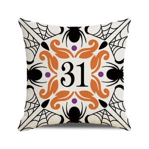 Halloween throw pillow cover featuring orange number 31 with spiders and web designs