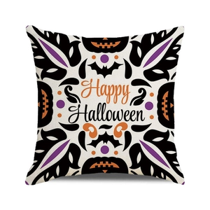 Detail of Happy Halloween pillow case with pumpkin and bat patterns on linen texture