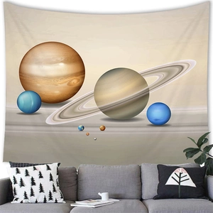 Detail view of a planetary solar system tapestry hanging over a gray sofa in a modern living room