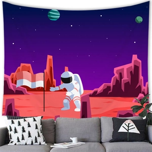 Detailed view of astronaut tapestry hanging over a sofa with vibrant space planet artwork