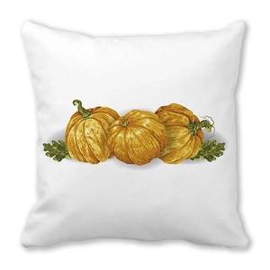 Detalle del estampado de calabaza en acuarela y hojas en funda de cojín cuadrada
