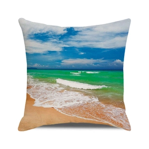 Detailed close-up of a square linen cushion cover with a tropical beach digital print