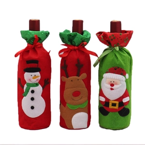 Three Christmas wine bottle covers featuring Santa Claus, Reindeer and Snowman patterns