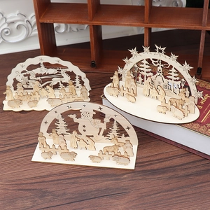 Three DIY wooden Christmas ornaments featuring Santa, nativity, and snowman scenes