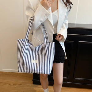 Large capacity canvas tote bag with classic blue and white stripes for daily commuting