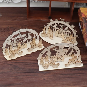 Detailed view of 3D layered wooden Christmas ornaments with laser-cut nativity and Santa scenes