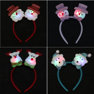 Detail of four glowing LED Christmas headbands featuring Santa, Snowman, Deer, and Bear