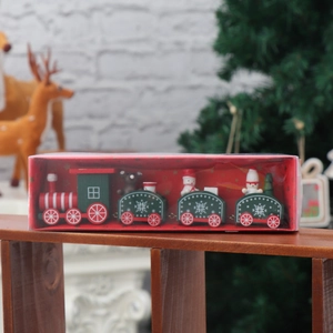Detail of a wooden Christmas train set with snowman and bear figures in a gift box