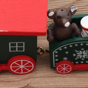 Classic red and green wooden Christmas train ornament with a cute mini bear figurine