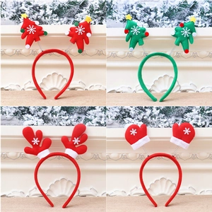 Detail set of four festive Christmas headbands with reindeer antlers and trees