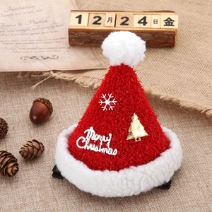Mini molletta cappello di Natale in maglia con fiocchi d'argento su sfondo di tela