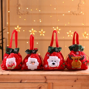 Close-up of four red flannel Christmas gift bags featuring 3D Santa and Snowman designs