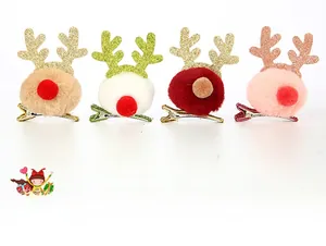 Detail view of four colorful plush reindeer antler hair clips with glitter accents