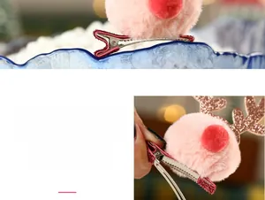 Detail of pink faux fur reindeer hair clip with sparkling sequin antlers and metal base