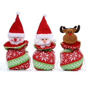 Three Christmas knitted drawstring gift bags with Santa, snowman and elk designs