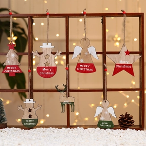 Detailed view of assorted Christmas wooden ornaments hanging on a rustic brown shelf