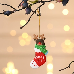 Reindeer in Christmas stocking hanging ornament with Baby's 1st text on festive background