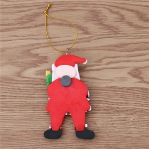 Detail of Santa Claus ornament back featuring a round black magnet and gold hanging cord