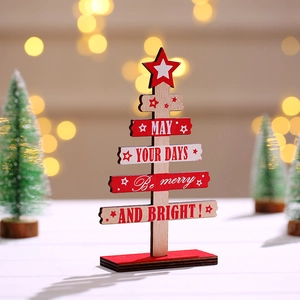 Handcrafted wooden mini Christmas tree desk decor with warm holiday bokeh background