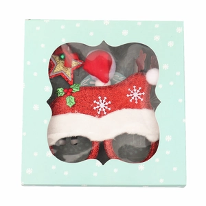 Lunettes de Noël avec chapeau scintillant et étoile dans une boîte cadeau flocons