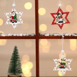 Detail of DIY Christmas wooden star ornaments with Santa, Snowman and Reindeer motifs