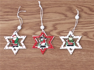 Close-up of three wooden Christmas star ornaments featuring Santa, snowman and reindeer
