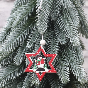 Detail of red wooden star ornament with snowman illustration and white hanging bead