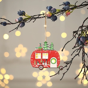 Lighted red wooden camper ornament with miniature tree and snowmen hung on a branch