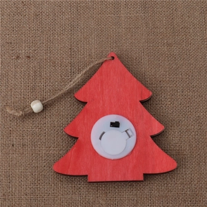 Detailed back view of a red wooden Christmas tree ornament with LED switch and jute cord
