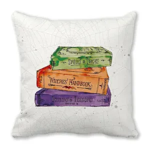Detail of Halloween peach skin pillow cover showing vintage magic book stack and spider webs