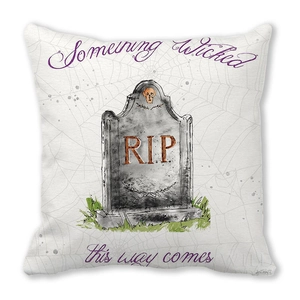 Close-up of Halloween peach skin pillow cover with RIP tombstone and spider web details