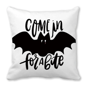 Detail of white Halloween pillowcase featuring black COME IN for A bite text and bat design