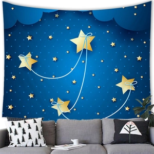Detail of blue starry night tapestry with golden stars hung over a grey fabric sofa