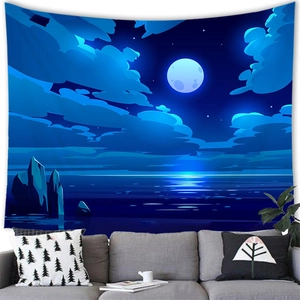 Detail of dark blue moonlit seascape wall tapestry hanging behind a white living room sofa