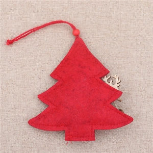 Detail of red felt Christmas tree ornament with wooden reindeer head and hanging loop