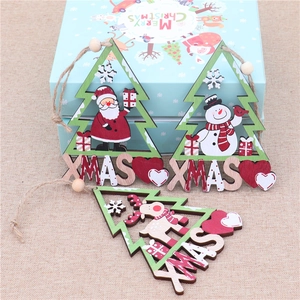Detailed view of wooden Christmas tree ornaments with Santa, snowman and elk figures