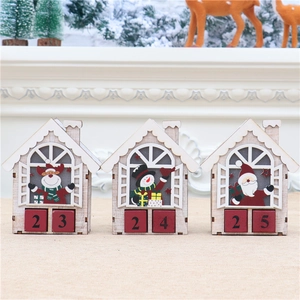 Detailed view of three LED wooden Christmas countdown calendar blocks with festive figures