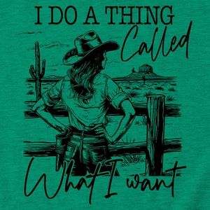 Close-up of green t-shirt fabric showing vintage cowgirl and cactus print details