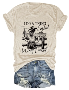 Close-up of oatmeal crewneck t-shirt with Western cowboy print and denim shorts