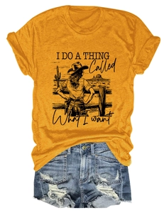 Flat lay of ginger yellow T-shirt with vintage desert graphic and denim shorts
