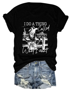 Detail of trendy black crew neck T-shirt with western graphic paired with denim shorts