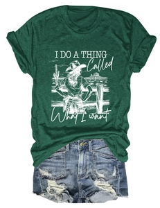 Flat lay of a green crew neck T-shirt with vintage print and distressed denim shorts