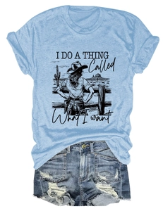 Detail of light blue T-shirt with vintage desert graphic and distressed denim shorts