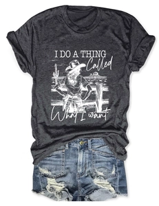 Flat lay of grey graphic t-shirt and distressed denim shorts with frayed edges