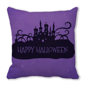 Close-up of Halloween cushion cover with castle and bat silhouette on purple background
